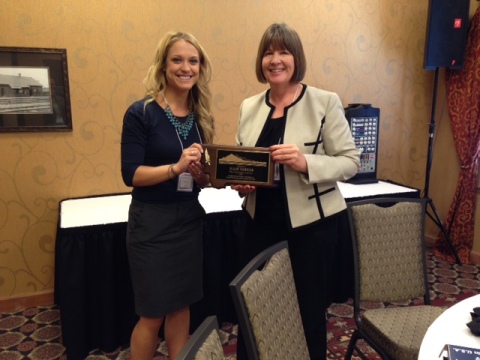 President Elect Melissa Hanson presenting Julie Parker with the 2014 School Psychologist of the Year Award at the 2014 Fall Conference